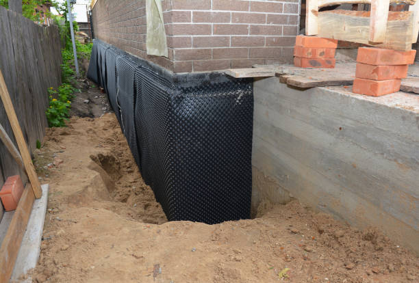 Happy homeowners after waterproofing job in Englewood Cliffs